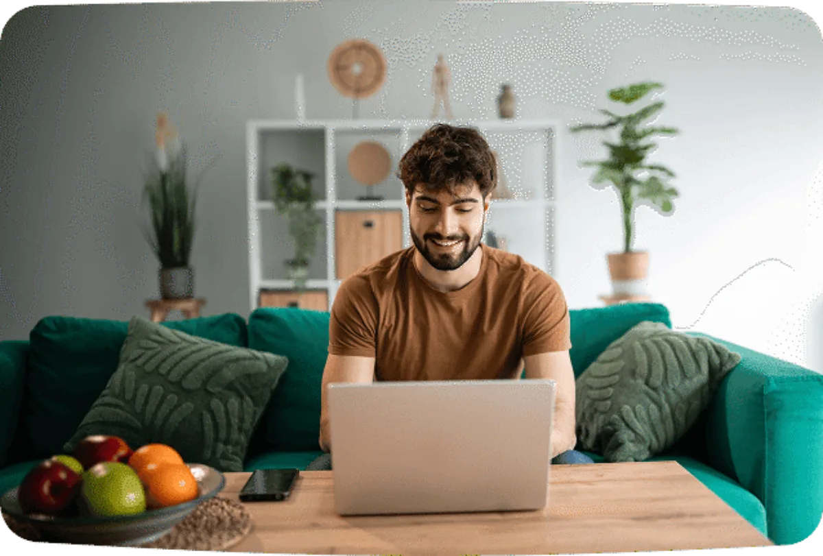 Man laptop sofa